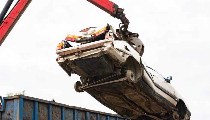 Car,In,A,Scrap,Yard,Being,Lifted,By,A,Mechanical