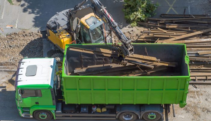 A,Grapple,Loader,Loads,Scrap,Industrial,Metal,For,Recycling. A,Grapple,Loader,Loads,Scrap,Industrial,Metal,For,Recycling.
